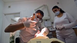 Dentist numbing patient
