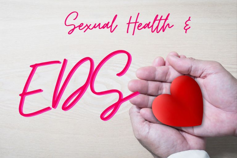 Two hands folded into each other holding a red heart. Text: Sexual Health & EDS. 