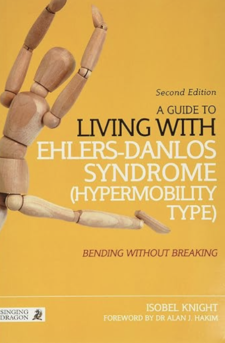Book cover living with Ehlers-Danlos Syndrome showing a wooden puppet