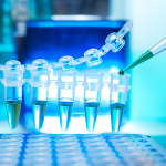 Plastic PCR tubs with green liquid inside