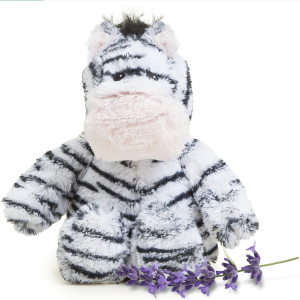 A small, plush zebra with a large muzzle sits upright with its hind legs out front. It is fuzzy with black and white strips.