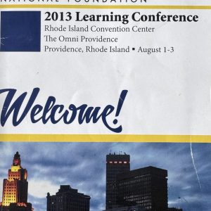 Cover of the Ehlers-Danlos National Foundation 2013 Learning Conference welcome brochure. The cover reads "2013 Learning Conference" and lists the Rhode Island Convention Center and The Omni Providence in Providence, Rhode Island, with conference dates of August 1–3. A nighttime photograph of the Providence skyline appears at the bottom of the cover.